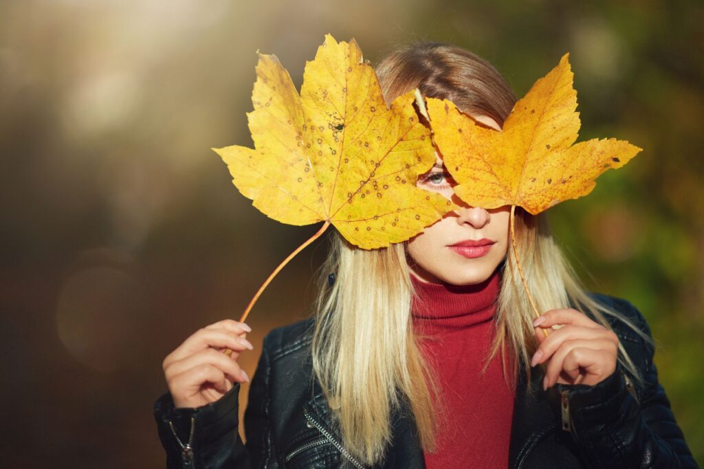 play with fall foliage dry leaves